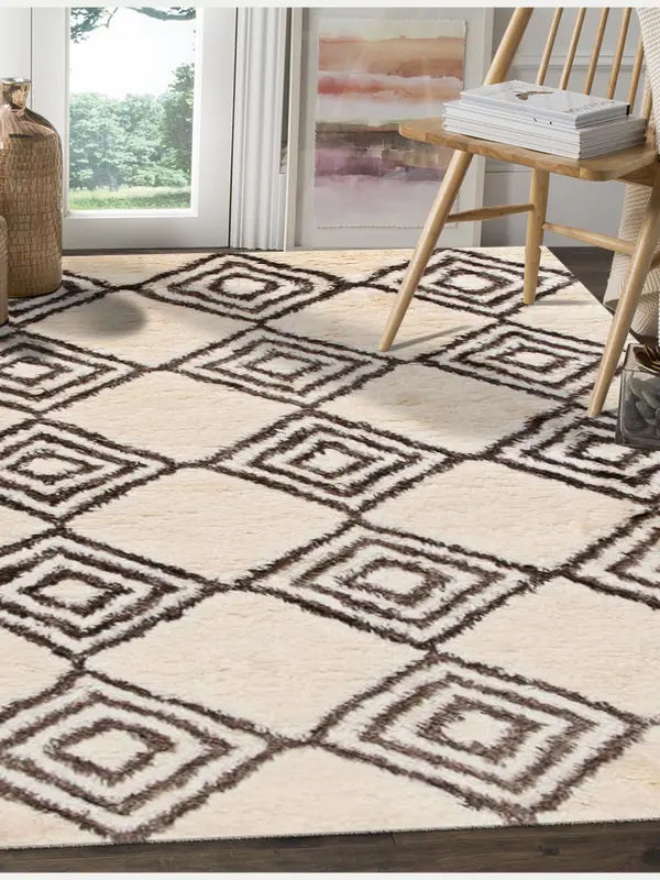 An ivory Beni Ourain carpet beside a wooden chair